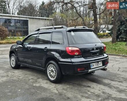 Чорний Міцубісі Аутлендер, об'ємом двигуна 2 л та пробігом 200 тис. км за 4700 $, фото 11 на Automoto.ua