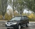 Черный Мицубиси Аутлендер, объемом двигателя 2 л и пробегом 178 тыс. км за 4700 $, фото 1 на Automoto.ua
