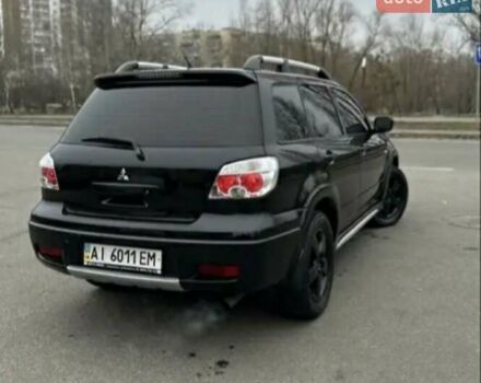 Черный Мицубиси Аутлендер, объемом двигателя 2.38 л и пробегом 319 тыс. км за 4800 $, фото 3 на Automoto.ua