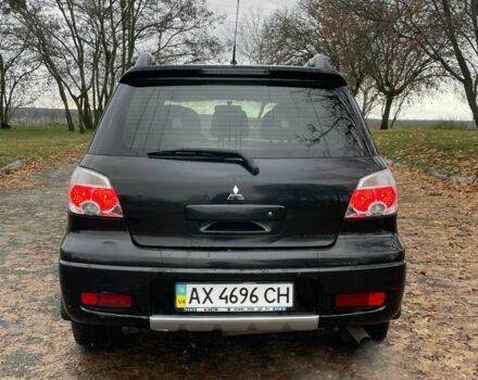 Черный Мицубиси Аутлендер, объемом двигателя 2.4 л и пробегом 213 тыс. км за 6850 $, фото 9 на Automoto.ua