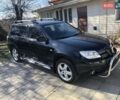 Черный Мицубиси Аутлендер, объемом двигателя 2 л и пробегом 130 тыс. км за 6400 $, фото 1 на Automoto.ua