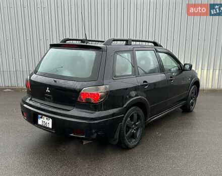 Чорний Міцубісі Аутлендер, об'ємом двигуна 2.38 л та пробігом 175 тис. км за 6000 $, фото 2 на Automoto.ua