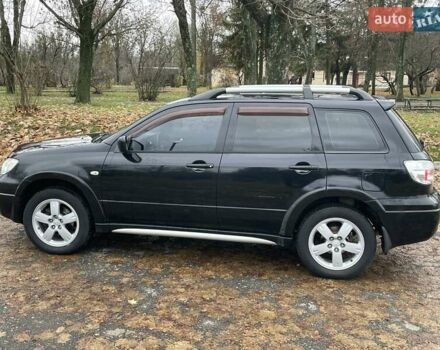 Чорний Міцубісі Аутлендер, об'ємом двигуна 2.4 л та пробігом 213 тис. км за 6850 $, фото 6 на Automoto.ua