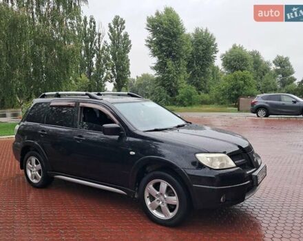 Чорний Міцубісі Аутлендер, об'ємом двигуна 2.4 л та пробігом 262 тис. км за 7300 $, фото 1 на Automoto.ua