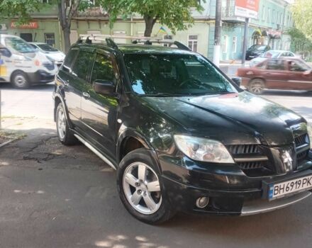 Черный Мицубиси Аутлендер, объемом двигателя 2.4 л и пробегом 248 тыс. км за 7000 $, фото 2 на Automoto.ua