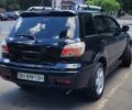 Чорний Міцубісі Аутлендер, об'ємом двигуна 2.4 л та пробігом 242 тис. км за 7100 $, фото 3 на Automoto.ua