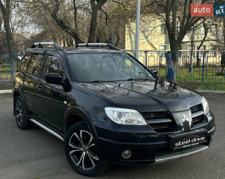 Черный Мицубиси Аутлендер, объемом двигателя 2.4 л и пробегом 320 тыс. км за 5999 $, фото 2 на Automoto.ua