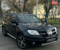 Черный Мицубиси Аутлендер, объемом двигателя 2.4 л и пробегом 320 тыс. км за 5999 $, фото 2 на Automoto.ua