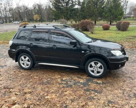 Черный Мицубиси Аутлендер, объемом двигателя 2.4 л и пробегом 213 тыс. км за 6850 $, фото 5 на Automoto.ua