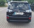 Черный Мицубиси Аутлендер, объемом двигателя 3 л и пробегом 150 тыс. км за 8000 $, фото 1 на Automoto.ua