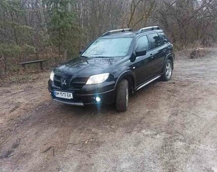Черный Мицубиси Аутлендер, объемом двигателя 2 л и пробегом 235 тыс. км за 7350 $, фото 1 на Automoto.ua