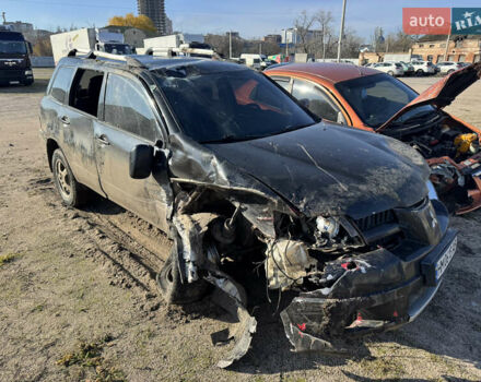 Черный Мицубиси Аутлендер, объемом двигателя 2 л и пробегом 258 тыс. км за 2200 $, фото 1 на Automoto.ua