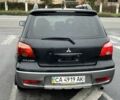 Черный Мицубиси Аутлендер, объемом двигателя 2 л и пробегом 300 тыс. км за 2650 $, фото 4 на Automoto.ua