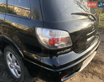 Черный Мицубиси Аутлендер, объемом двигателя 2.4 л и пробегом 260 тыс. км за 7200 $, фото 12 на Automoto.ua