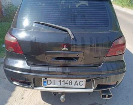 Чорний Міцубісі Аутлендер, об'ємом двигуна 2 л та пробігом 290 тис. км за 6350 $, фото 9 на Automoto.ua