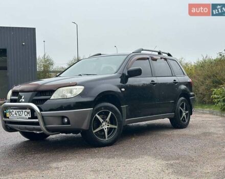 Черный Мицубиси Аутлендер, объемом двигателя 2 л и пробегом 295 тыс. км за 5300 $, фото 13 на Automoto.ua