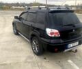 Чорний Міцубісі Аутлендер, об'ємом двигуна 2.4 л та пробігом 233 тис. км за 6350 $, фото 2 на Automoto.ua