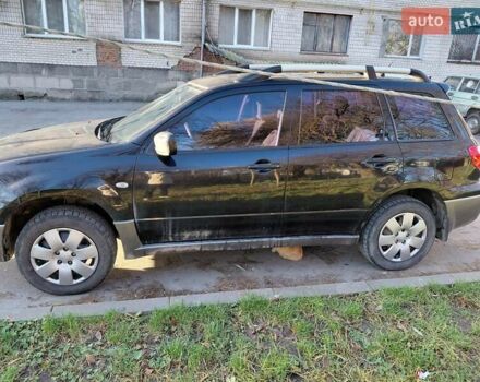 Чорний Міцубісі Аутлендер, об'ємом двигуна 2 л та пробігом 260 тис. км за 5500 $, фото 1 на Automoto.ua