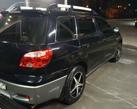 Черный Мицубиси Аутлендер, объемом двигателя 2 л и пробегом 295 тыс. км за 5300 $, фото 6 на Automoto.ua