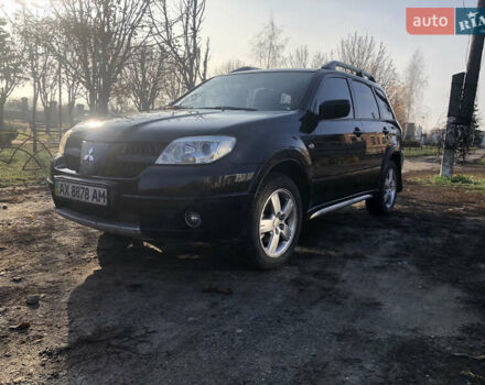 Черный Мицубиси Аутлендер, объемом двигателя 2.4 л и пробегом 260 тыс. км за 7200 $, фото 2 на Automoto.ua