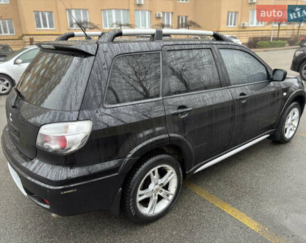 Чорний Міцубісі Аутлендер, об'ємом двигуна 2.4 л та пробігом 169 тис. км за 8000 $, фото 3 на Automoto.ua