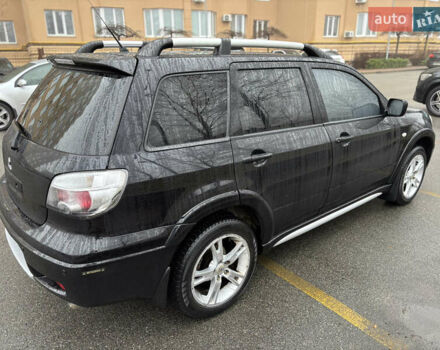 Чорний Міцубісі Аутлендер, об'ємом двигуна 2.4 л та пробігом 169 тис. км за 8000 $, фото 2 на Automoto.ua