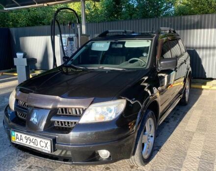 Черный Мицубиси Аутлендер, объемом двигателя 2.4 л и пробегом 219 тыс. км за 6500 $, фото 2 на Automoto.ua