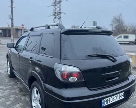 Чорний Міцубісі Аутлендер, об'ємом двигуна 2.4 л та пробігом 202 тис. км за 5800 $, фото 6 на Automoto.ua
