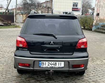 Чорний Міцубісі Аутлендер, об'ємом двигуна 2 л та пробігом 220 тис. км за 6299 $, фото 5 на Automoto.ua
