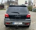 Чорний Міцубісі Аутлендер, об'ємом двигуна 2 л та пробігом 220 тис. км за 6299 $, фото 5 на Automoto.ua
