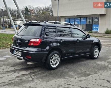 Черный Мицубиси Аутлендер, объемом двигателя 2 л и пробегом 200 тыс. км за 4900 $, фото 3 на Automoto.ua