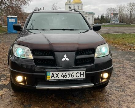 Черный Мицубиси Аутлендер, объемом двигателя 2.4 л и пробегом 213 тыс. км за 6850 $, фото 2 на Automoto.ua