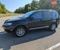 Черный Мицубиси Аутлендер, объемом двигателя 2.36 л и пробегом 235 тыс. км за 8200 $, фото 1 на Automoto.ua