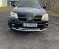Чорний Міцубісі Аутлендер, об'ємом двигуна 2.38 л та пробігом 300 тис. км за 7700 $, фото 1 на Automoto.ua