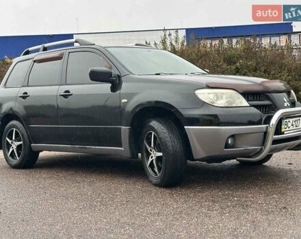 Черный Мицубиси Аутлендер, объемом двигателя 2 л и пробегом 295 тыс. км за 5300 $, фото 12 на Automoto.ua