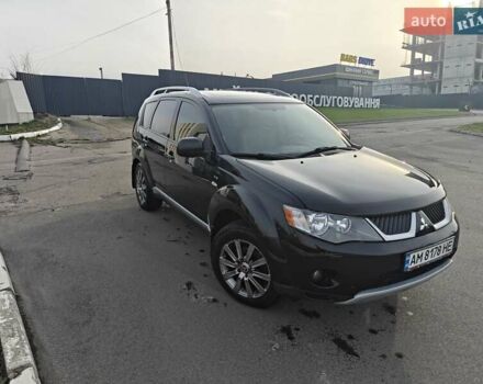 Черный Мицубиси Аутлендер, объемом двигателя 3 л и пробегом 155 тыс. км за 9800 $, фото 1 на Automoto.ua