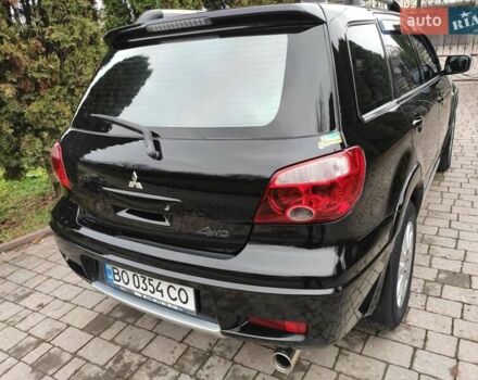 Черный Мицубиси Аутлендер, объемом двигателя 2 л и пробегом 180 тыс. км за 6000 $, фото 5 на Automoto.ua