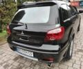 Черный Мицубиси Аутлендер, объемом двигателя 2 л и пробегом 180 тыс. км за 6000 $, фото 5 на Automoto.ua