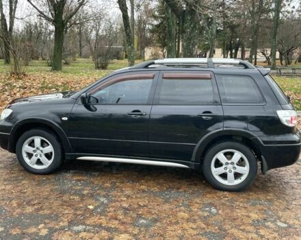 Черный Мицубиси Аутлендер, объемом двигателя 2.4 л и пробегом 213 тыс. км за 6850 $, фото 6 на Automoto.ua