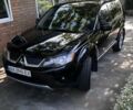 Черный Мицубиси Аутлендер, объемом двигателя 3 л и пробегом 200 тыс. км за 9300 $, фото 1 на Automoto.ua