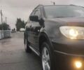 Чорний Міцубісі Аутлендер, об'ємом двигуна 2 л та пробігом 165 тис. км за 6000 $, фото 8 на Automoto.ua