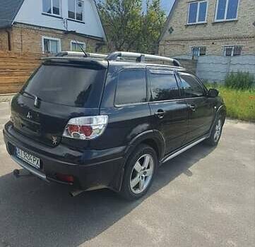 Черный Мицубиси Аутлендер, объемом двигателя 2.4 л и пробегом 270 тыс. км за 6900 $, фото 3 на Automoto.ua