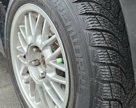 Черный Мицубиси Аутлендер, объемом двигателя 2 л и пробегом 200 тыс. км за 4900 $, фото 4 на Automoto.ua