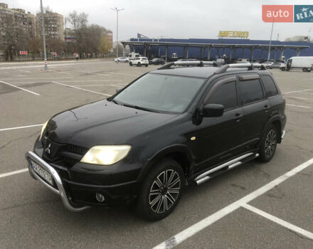 Черный Мицубиси Аутлендер, объемом двигателя 2.38 л и пробегом 314 тыс. км за 5000 $, фото 2 на Automoto.ua