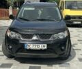Черный Мицубиси Аутлендер, объемом двигателя 2 л и пробегом 311 тыс. км за 7900 $, фото 1 на Automoto.ua