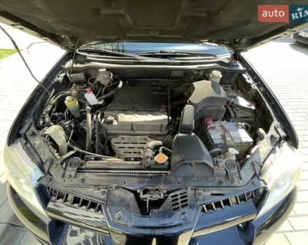 Черный Мицубиси Аутлендер, объемом двигателя 2.38 л и пробегом 310 тыс. км за 7500 $, фото 3 на Automoto.ua