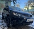 Черный Мицубиси Аутлендер, объемом двигателя 3 л и пробегом 228 тыс. км за 10000 $, фото 1 на Automoto.ua
