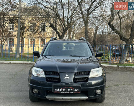Черный Мицубиси Аутлендер, объемом двигателя 2.4 л и пробегом 320 тыс. км за 5999 $, фото 1 на Automoto.ua