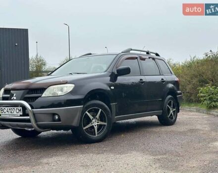 Черный Мицубиси Аутлендер, объемом двигателя 2 л и пробегом 295 тыс. км за 5300 $, фото 16 на Automoto.ua