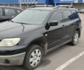 Чорний Міцубісі Аутлендер, об'ємом двигуна 2 л та пробігом 175 тис. км за 7800 $, фото 1 на Automoto.ua